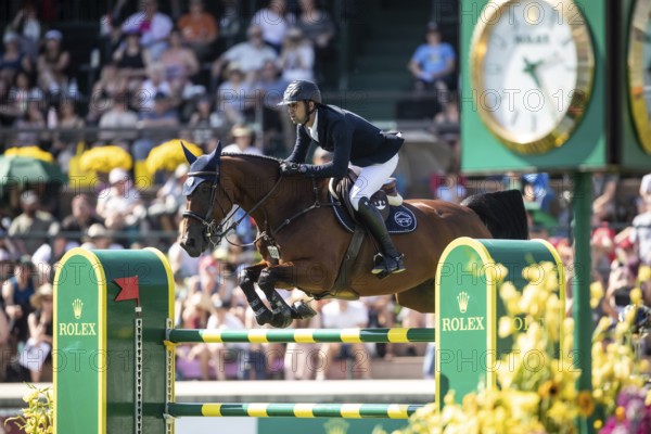 Nayel Nassar of Egypt and riding Capital Night Star compete in the first round of the 1.60m CPKC International during the Spruce Meadows Masters, presented by Rolex, in Calgary, Alberta, Canada, North America