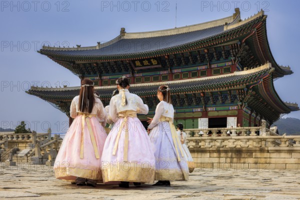 Young woman dressed in traditional Korean Hanbok dress, Gyeongbokgung Palace, Seoul, Republic of Korea