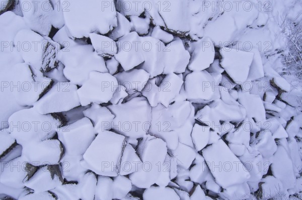 Aerial view of pile of large stones covered with snow in winter, Kuhakoski, Nurmijärvi, Finland, Europe