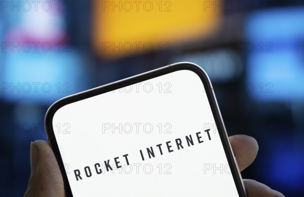 Rocker internet logo is displayed on smartphone. Rocket Internet SE is a German Internet company
