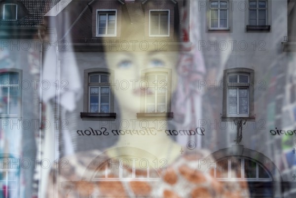 Reflection in a windowpane, women's fashion, Bad Karlshafen, Weser Uplands, Weserbergland, Hesse, Germany, Europe