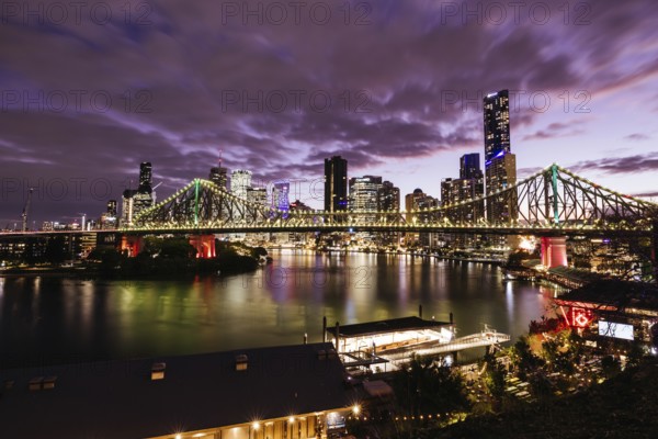 Brisbane skyline and Story Bridge from the suburb of New Farm and Wilson Outlook Reserve at dusk in Queensland, Australia, Oceania
