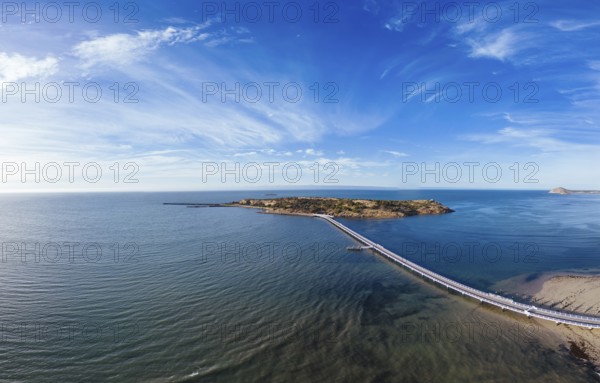 An aerial view of the famous Granite Island Recreation Park and causeway in Victor Harbor on a sunny autumn day in South Australia, Australia, Oceania