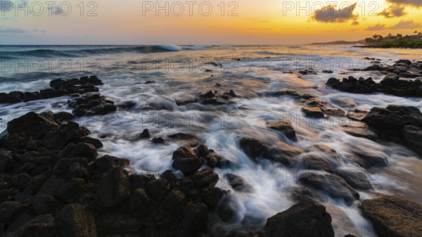 A dramatic sunset looking over the Pacific Ocean. Kauai, Hawaii