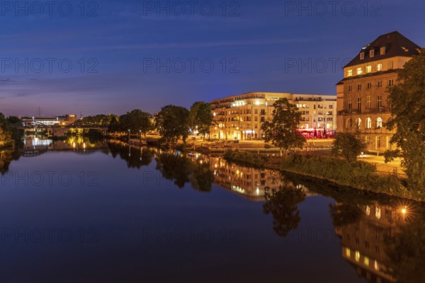 Muelheim an der Ruhr, North Rhine-Westfalia, Germany, July 26, 2018: View over the river Ruhr at night into the city and the Ruhrpromenade, Europe