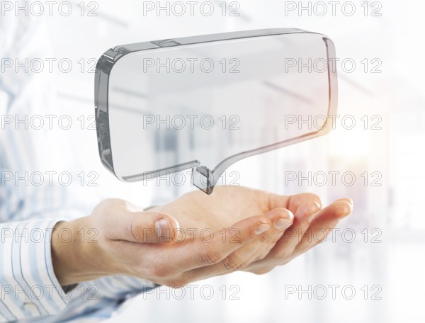 Close of businessman hands showing glass speech bubble as internet concept. Mixed media