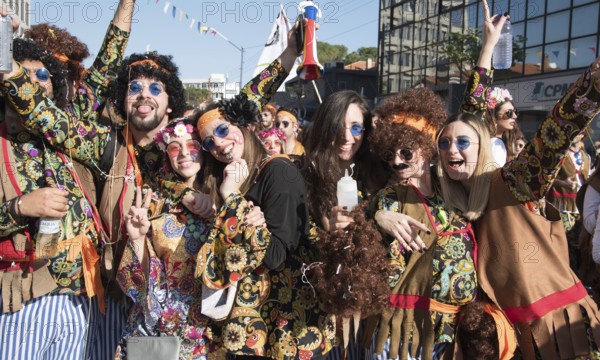 Limassol, Cyprus, February 18 2018: Happy team of people dressed in colourful costumes enjoying and parading at the famous carnival parade in Limassol city, Cyprus, Europe
