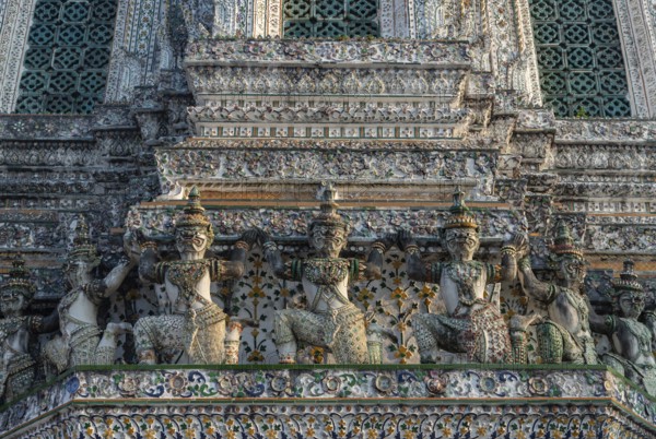 A picture of the statues at the Wat Arun Temple