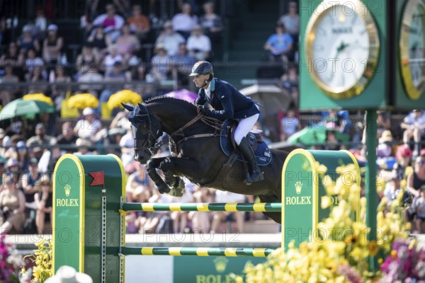 Denis Lynch of Ireland and riding Vistogrand compete in the first round of the 1.60m CPKC International during the Spruce Meadows Masters, presented by Rolex, in Calgary, Alberta, Canada, North America