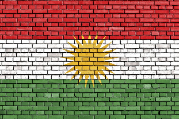 Flag of Kurdistan painted on brick wall