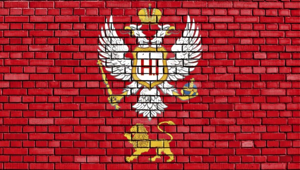 Flag of Principality of Montenegro painted on brick wall