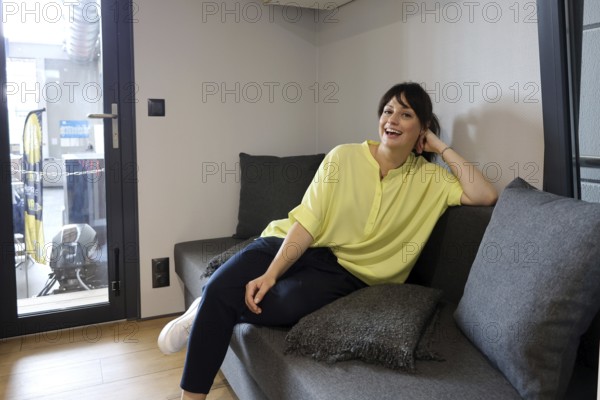 The Interboot 2024 trade fair in Friedrichshafen opens its doors on 25 September 2024. During the press tour and the presentation of the trade fair innovations, model Cora was already fascinated and took a seat on the comfortable sofa, Friedrichshafen, Germany / Germany