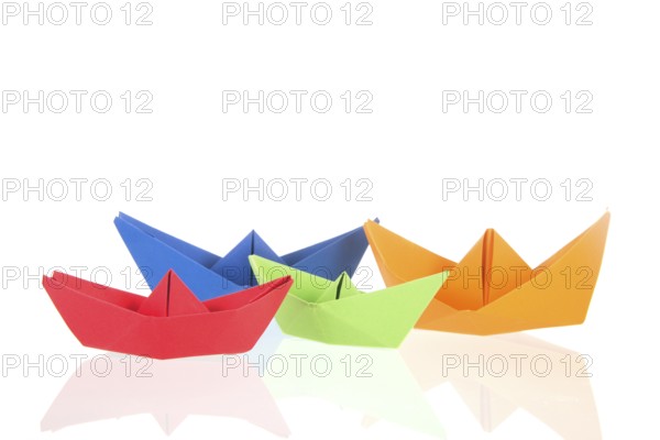 Folded boats and stack paper isolated over white background