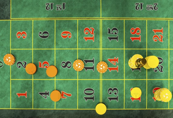 Roulette table chips in a casino. Closed up of casino roulette gambling table game. Yellow and orange chips