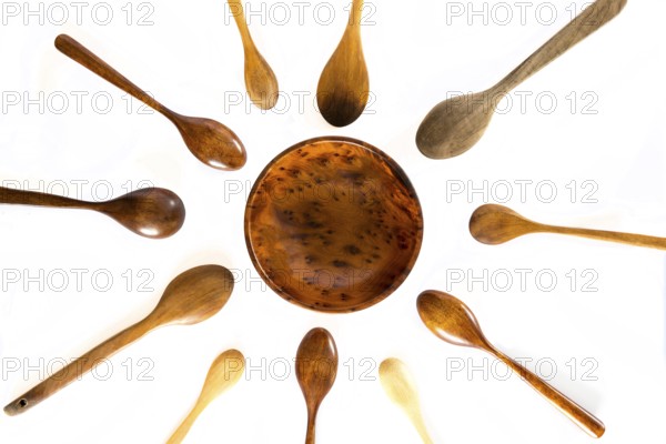 Wooden pregnancy concept on a white background. Studio shot. Set of kitchen utensil