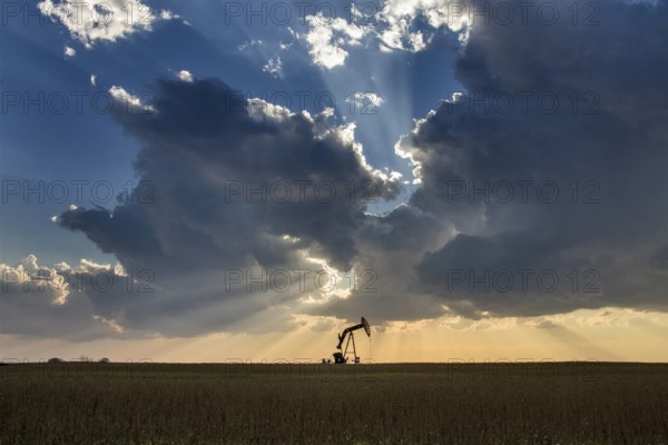 Prairie Storm Clouds Saskatchewan oil pump jack