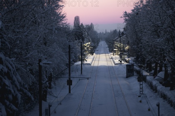 Railway tracks and surroundings covered with snow under winter sun, Allensbach, Lake Constance, Baden-Württemberg, Germany, Europe