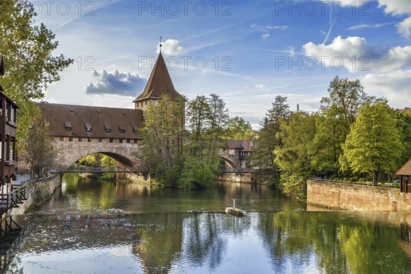 Pedestrian chain bridge (Kettensteg) and the medieval city wall behind it, Nuremberg, Germany, Europe