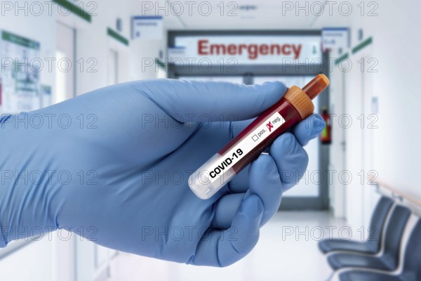 Covid 19 person holding a test tube with coronavirus, in the lab