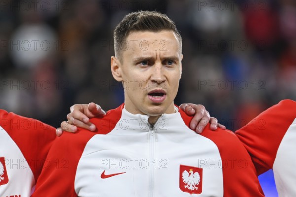 PRAGUE, CZECH REPUBLIC - MARCH 24, 2023: Qualifications for UEFA Euro 2024. Match Czech Republic - Poland 3:1. Przemyslaw Frankowski during anthem.