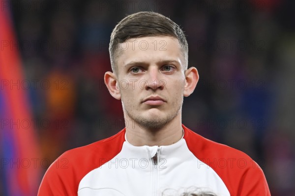PRAGUE, CZECH REPUBLIC - MARCH 24, 2023: Qualifications for UEFA Euro 2024. Match Czech Republic - Poland 3:1. Sebastian Szymanski during anthem.