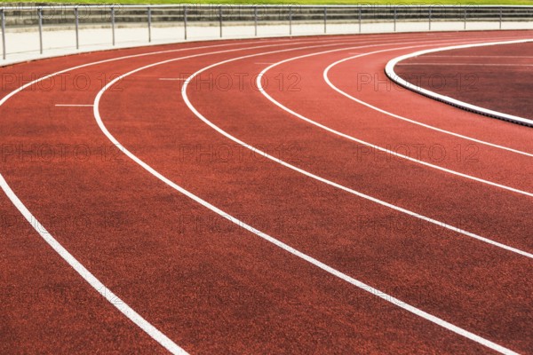 Cinder track in detail in a stadium in summer