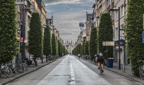 Leuven, Flanders, Belgium, 06 16 2019 Man on a bike driving down the Bondgenotenlaan at the railwaystation, Europe