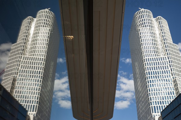 08.06.2019, Berlin, Germany, Europe, The tower of the Upper West building complex on Kurfürstendamm in Berlin-Charlottenburg is reflected in a shop window. The building was designed by architects Christoph Langhof and KSP Jürgen Engel, Europe