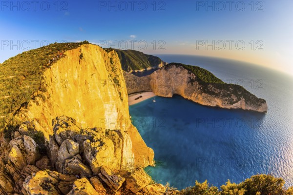 The coast of the Greek island of Zakynthos. Famous Shipwreck Beach. Romantic fabulous sunset. The concept of active, ecological and photo tourism