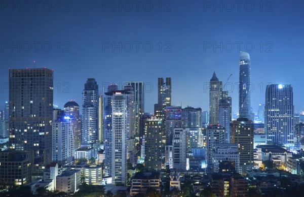 Cityscape night view of Bangkok modern office business building and high skyscraper in business district at Bangkok, Thailand, Asia