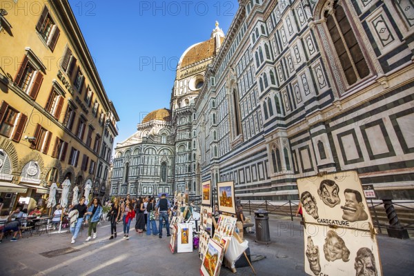 Florence Tuscany Italy on September 30, 2019 Artists exhibit paintings in front of the Duomo in Piazza del Duomo