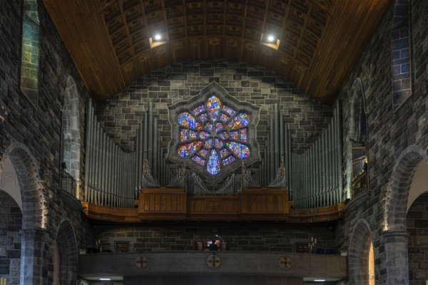 Galway, Ireland, 28 July, 2022: close-up view of the organ and stained glass window in the nave of the Galway Cathedral, Europe