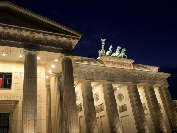Side view of the Brandenburg Tor at night, architectural details illuminated, Berlin, Germany, Europe