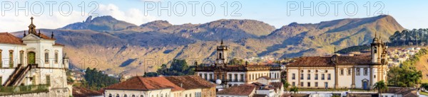 Panoramic photograph of the historic city of Ouro Preto in Minas Gerais with its baroque churches and monuments and hills