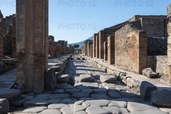 POMPEII, ITALY, MAY 04, 2022, A crosswalk of a typical Roman road in the ancient city of Pompeii, Southern Italy