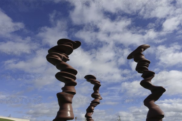 Würth Museum 2, Abstract wooden sculptures tower up into the partly cloudy sky, Carmen Würth Forum, Gaisbach, Künzelsau, Baden-Württemberg, Germany, Europe