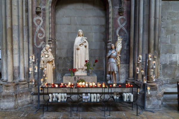 Dijon, France, 14 September, 2022: votive candles and altar in a side chapel of the Notre Dame of Dijon church, Europe
