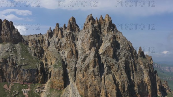 Aerial view on Naujiza or Mother-in-law teeth mountain with fantastic cliffs in Kabardino-Balkaria, Caucasus, Russia, Europe