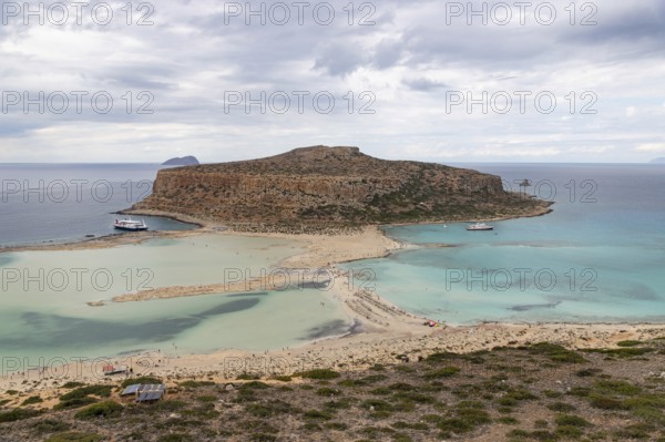 A picture of the blue water of Balos Beach and the nearby landscape of the Gramvousa Peninsula