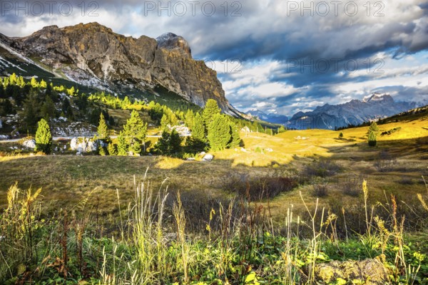 Travel in the Dolomites, pass Faltsarego. The last fine days of autumn. The concept of active and extreme tourism