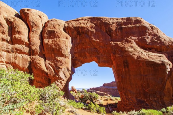 North Window & South Window Arches. The beauty of Arches Park in USA. Picturesque red-brown sandstone cliffs form a unique landscape. Grandiose rock compositions natural origin