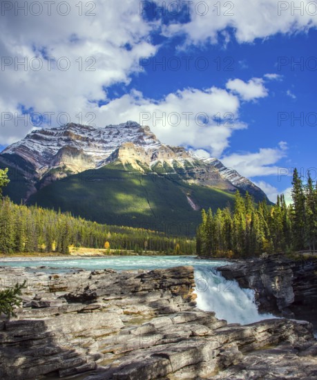 The magnificent powerful Athabasca Falls, popular with tourists. Rocky Mountains of Canada. The Athabasca River begins at the Columbia Glacier. Travel and photo tourism concept