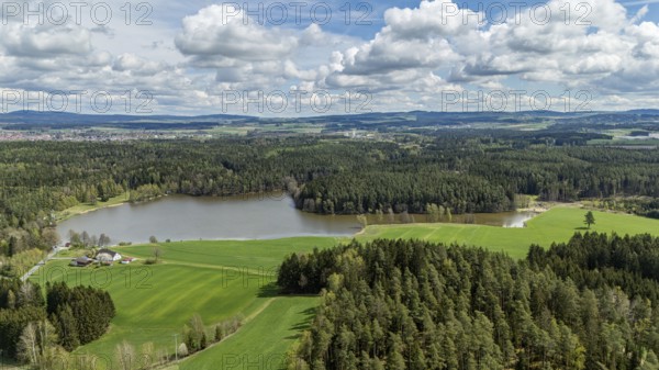 Green landscape with a lake, surrounded by forests and fields under a cloudy sky, Tirschenreuth, Upper Palatinate, Bavaria, Germany, Europe