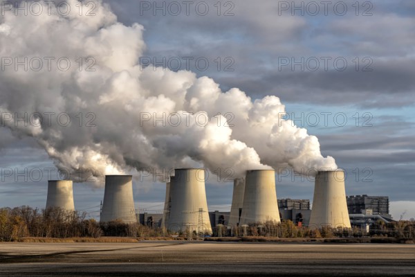 Towers of a power plant in Germany with huge clouds of exhaust fumes