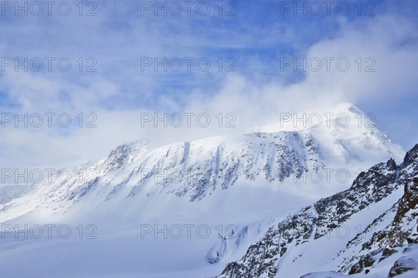 Landscape with high mountains covered snow