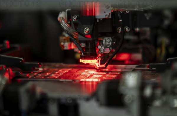 Robotic machine manufacturing semiconductor computer ship at a stall to show investors, during The Advantage Assam 2.0 Investment Summit in Guwahati, India on 25 February 2025