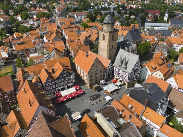 Bird's eye view of the lively market square of a historic town with half-timbered houses and a church, aerial view, Bückinghaus, wine house, Walpurgis church, town hall, market square, old town, Alsfeld, Hesse, Germany, Europe