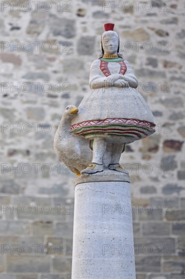 Schwälmer fountain with Little Red Riding Hood and goose figure, Gänseliesel, fairy tale figure, traditional traditional costume, skirt, detail, Alsfeld, Vogelsberg, Hesse, Germany, Europe