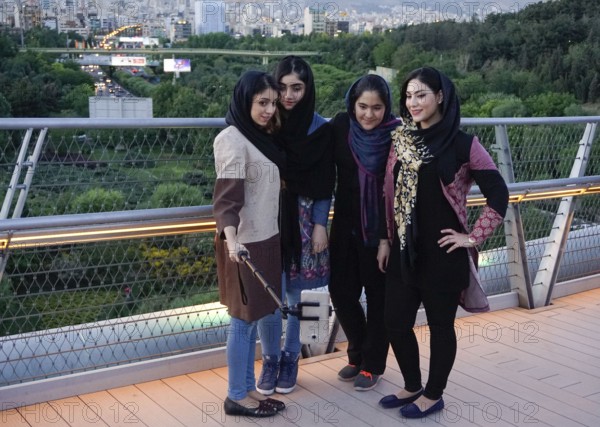 Women take selfie photos of themselves on the Tabiat Bridge in Tehran, Iran. The 270-metre-long bridge at Ab-o-Atash Park was designed by Iranian architect Leila Araghian and has become a popular meeting place, 21.05.2016