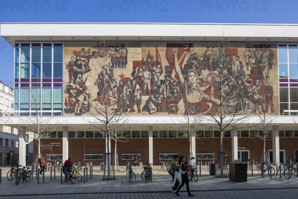 Kulturpalst from 1969, it is the home venue of the Dresden Philharmonic Orchestra, the cabaret theatre die Herkuleskeule and the city library and was reopened in 2017 after extensive renovations. The west side of the building is occupied by the 30 metre by 10.5 metre mural Der Weg der roten Fahne. (4) It has been recognised as a cultural monument since 2001. Gerhard Bondzin was commissioned to create the designs in 1968. The mural was realised until 1969 by a working group from the Dresden Academy of Fine Arts. The working title was: 849 - 1969: 120 years of the city's revolutionary forces fighting for progress and socialism, Dresden, Saxony, Germany, Europe